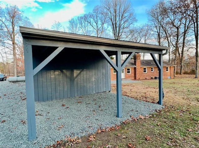 view of outbuilding with a lawn