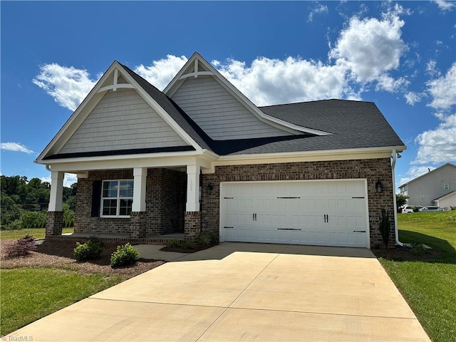 103 Jasper Ct, King, NC 27021 - craftsman inspired home featuring brick siding, a garage, and covered porch
