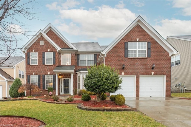 view of front of house with a garage, concrete driveway, brick siding, and a front lawn