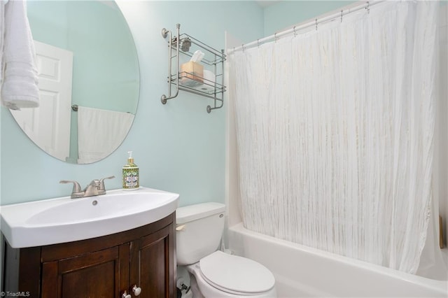 bathroom with shower / bath combination with curtain, vanity, and toilet