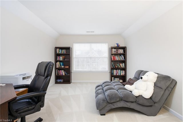 home office featuring lofted ceiling, carpet flooring, visible vents, and baseboards