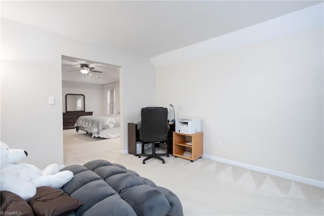 office space featuring vaulted ceiling, carpet, and baseboards