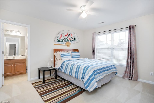 bedroom featuring light carpet, visible vents, and baseboards