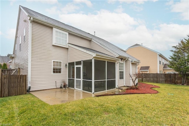 rear view of house featuring a sunroom, a patio area, fence, and a yard