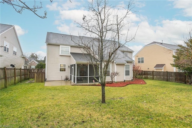 rear view of property with a sunroom, a fenced backyard, a lawn, and a patio