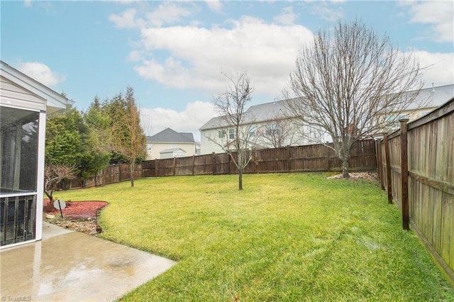 view of yard with a fenced backyard and a patio