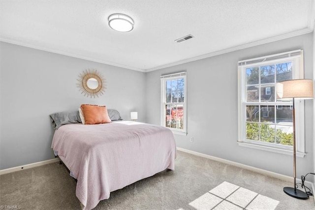 bedroom with crown molding and carpet