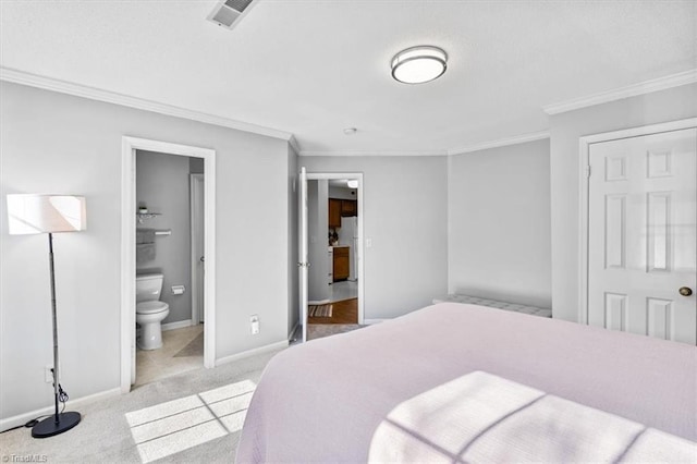 bedroom featuring connected bathroom, crown molding, and light colored carpet