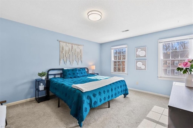 bedroom featuring light carpet