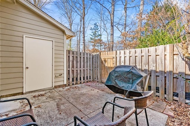 view of patio featuring a grill