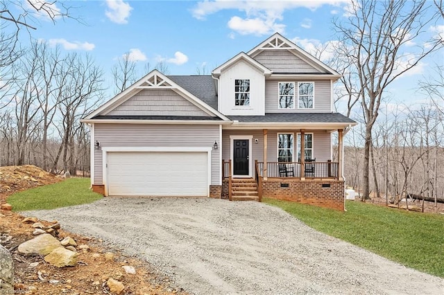 craftsman-style house with driveway, a garage, a front yard, and covered porch