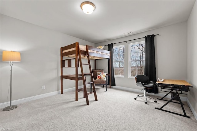 bedroom with carpet floors, visible vents, and baseboards
