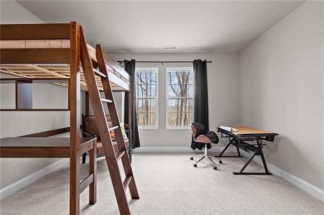 bedroom with baseboards, visible vents, and carpet