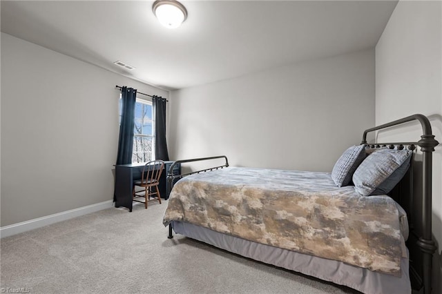 carpeted bedroom with baseboards and visible vents