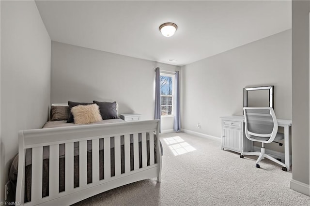 bedroom featuring baseboards and carpet floors