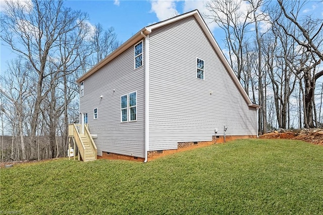 view of home's exterior with a lawn and crawl space