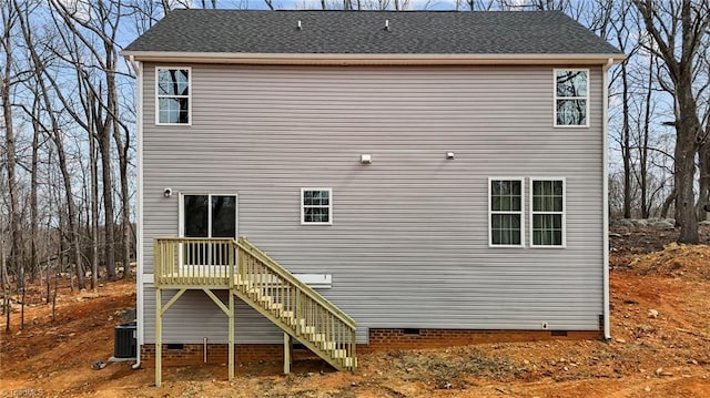 rear view of property featuring crawl space, stairs, central air condition unit, and a deck