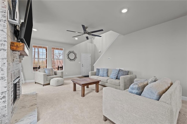 living area featuring recessed lighting, baseboards, a ceiling fan, and light colored carpet
