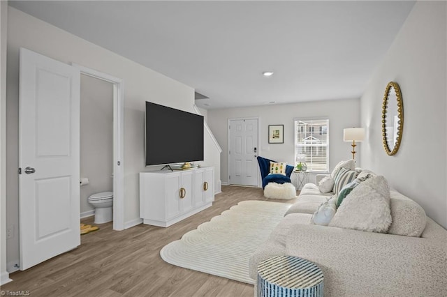 living room with light hardwood / wood-style flooring