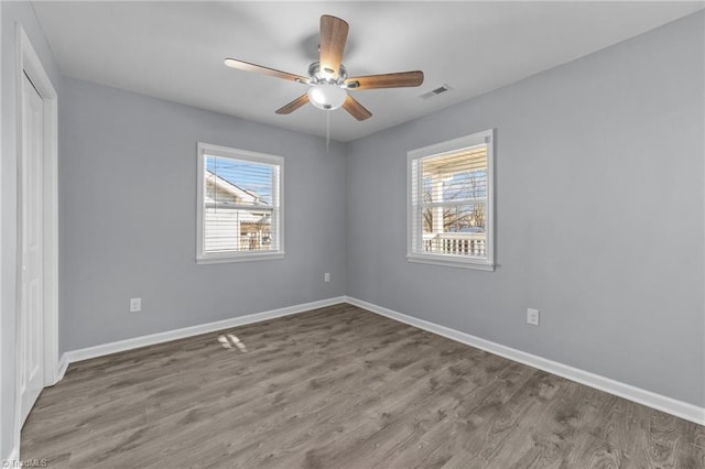 spare room with ceiling fan and hardwood / wood-style floors