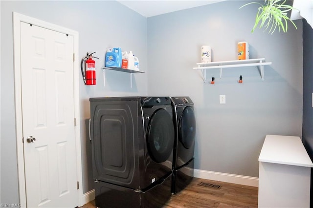 7768 Pinecone Ln, Hickory, NC 28602 - washroom with washing machine and dryer, baseboards, and wood finished floors