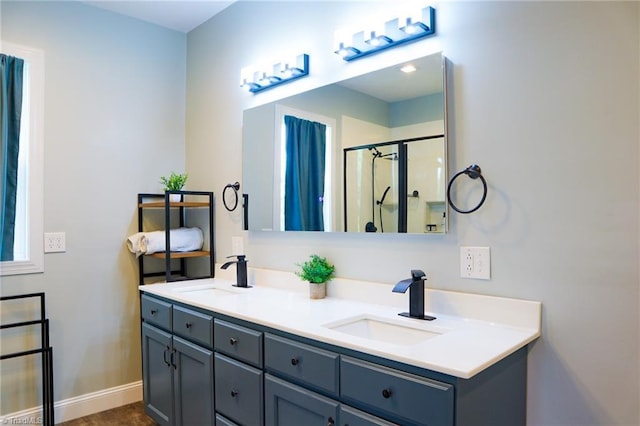 7768 Pinecone Ln, Hickory, NC 28602 - bathroom featuring double vanity, a stall shower, and baseboards