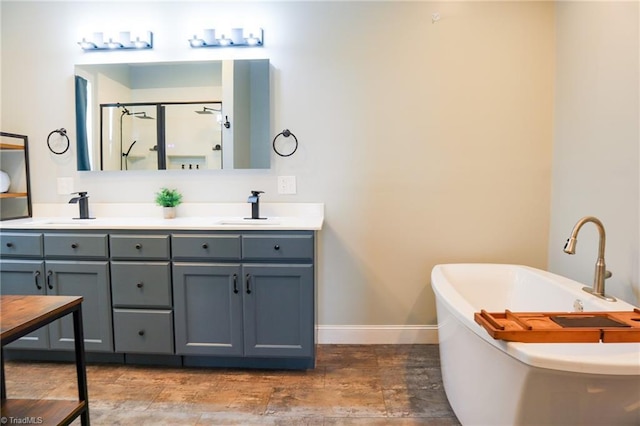7768 Pinecone Ln, Hickory, NC 28602 - full bathroom with baseboards, a stall shower, double vanity, and a freestanding bath