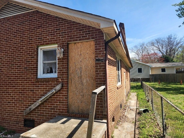 218 Huffman St, Greensboro, NC 27401 - view of side of home featuring crawl space and brick siding