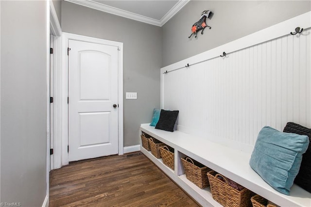 mudroom with dark wood-type flooring and crown molding