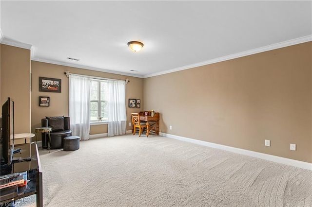 sitting room featuring crown molding and carpet floors