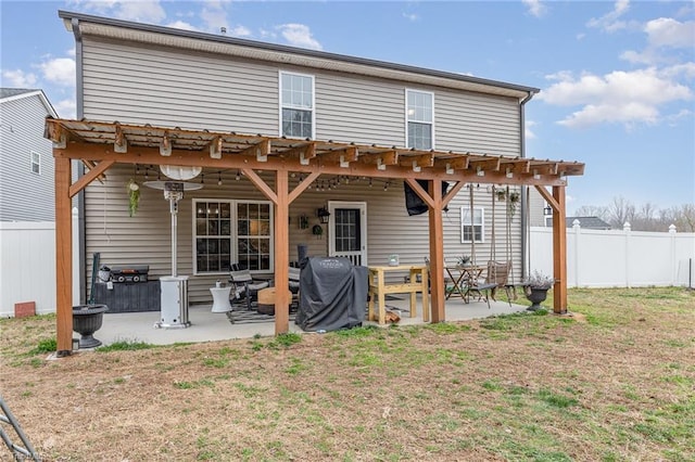 rear view of property featuring a patio
