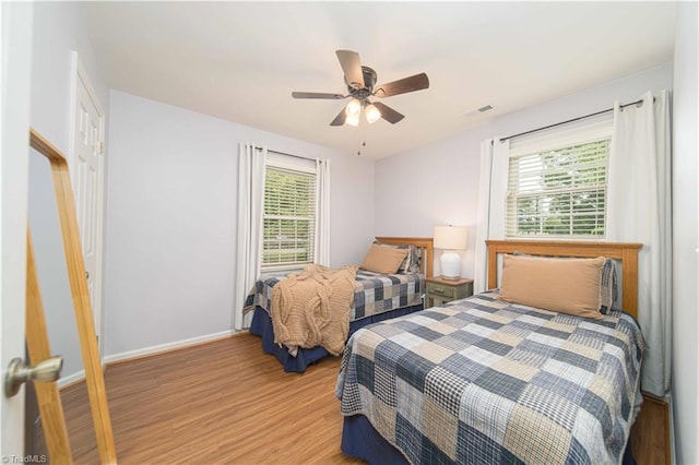 795 Morris Rd, Winston-Salem, NC 27101 - bedroom featuring multiple windows, light wood-style flooring, baseboards, and ceiling fan