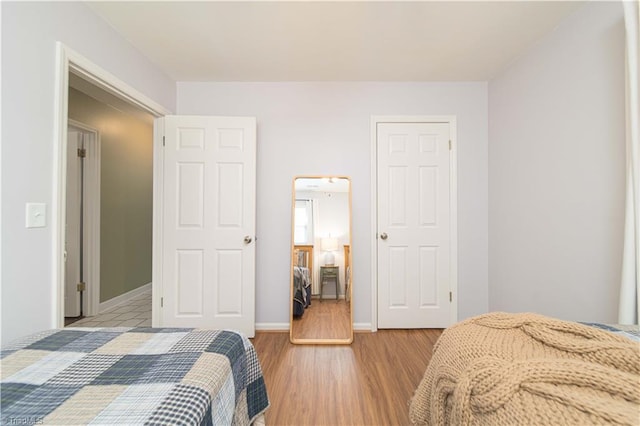 795 Morris Rd, Winston-Salem, NC 27101 - bedroom with light wood-style floors and baseboards