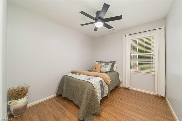 795 Morris Rd, Winston-Salem, NC 27101 - bedroom with light wood-style flooring, baseboards, and ceiling fan