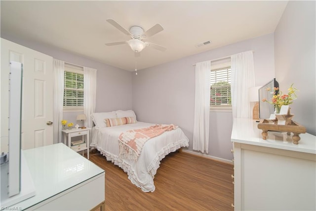 795 Morris Rd, Winston-Salem, NC 27101 - bedroom with wood finished floors, baseboards, and a ceiling fan