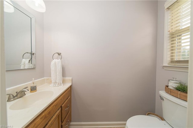 795 Morris Rd, Winston-Salem, NC 27101 - bathroom with toilet, vanity, and baseboards