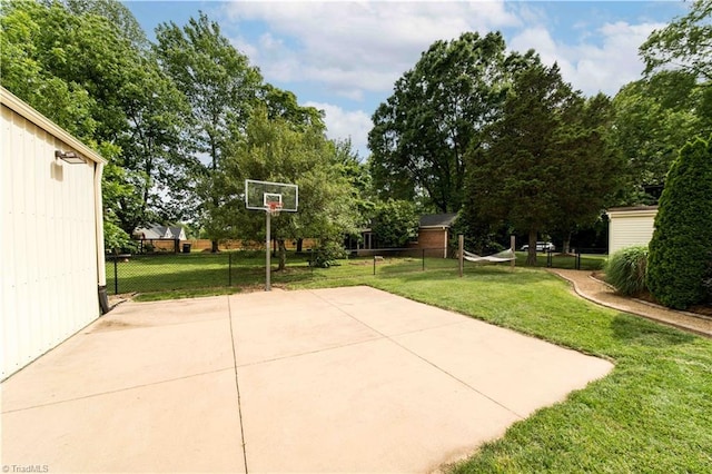 795 Morris Rd, Winston-Salem, NC 27101 - view of patio featuring basketball hoop and view of wooded area