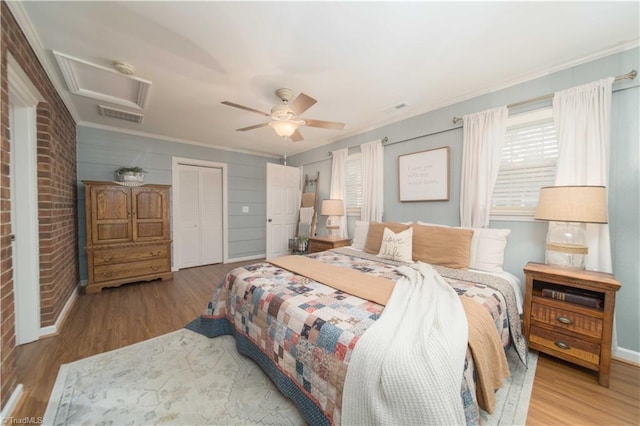 795 Morris Rd, Winston-Salem, NC 27101 - bedroom with attic access, ornamental molding, wood finished floors, a closet, and a ceiling fan