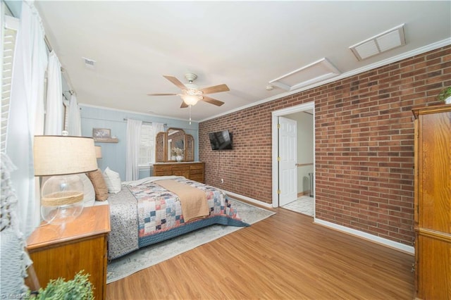 795 Morris Rd, Winston-Salem, NC 27101 - bedroom with attic access, brick wall, crown molding, wood finished floors, and ceiling fan