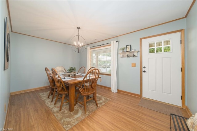 795 Morris Rd, Winston-Salem, NC 27101 - dining space with light wood-style floors, a chandelier, baseboards, and crown molding