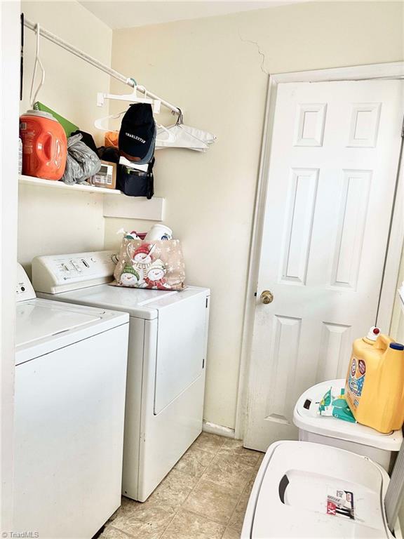 laundry area with washer and clothes dryer