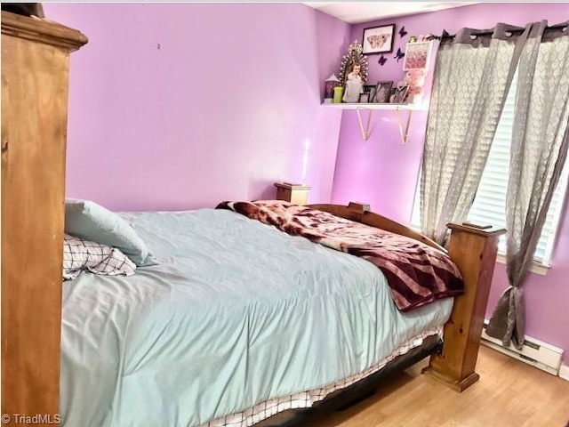 bedroom with hardwood / wood-style flooring