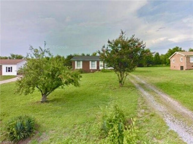 view of front of home with a front yard