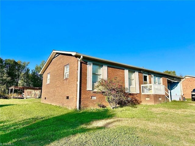 back of house with a lawn