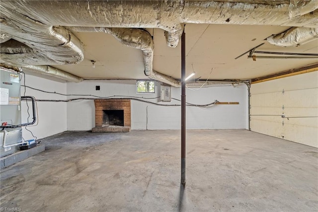 below grade area featuring a brick fireplace
