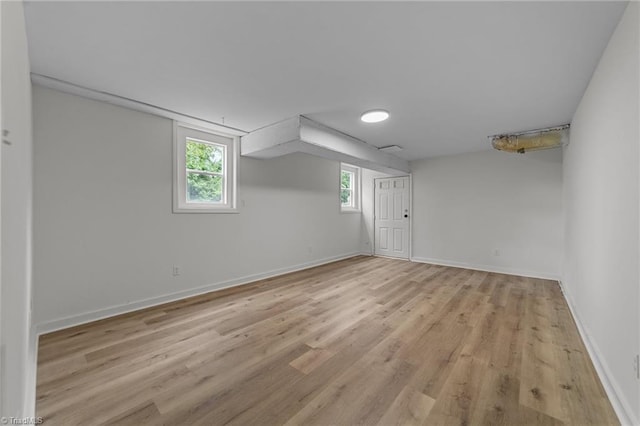 below grade area with light wood-type flooring and baseboards