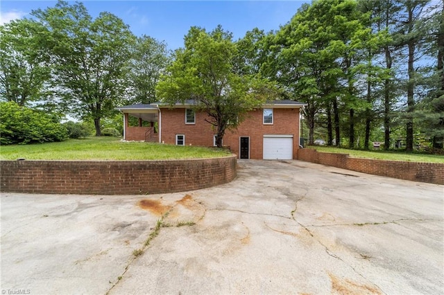 view of property exterior with an attached garage, concrete driveway, a lawn, and brick siding