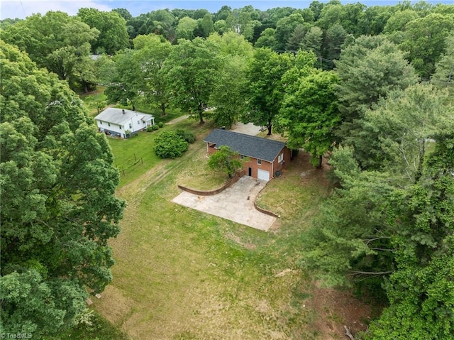 aerial view of property's location with a forest