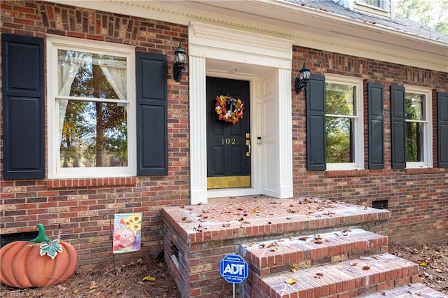 view of exterior entry featuring a porch