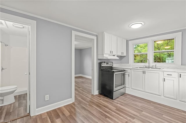 kitchen with light wood-type flooring, electric range, sink, white cabinets, and ornamental molding